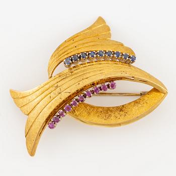 Brooch, 18K gold with rubies and sapphires.