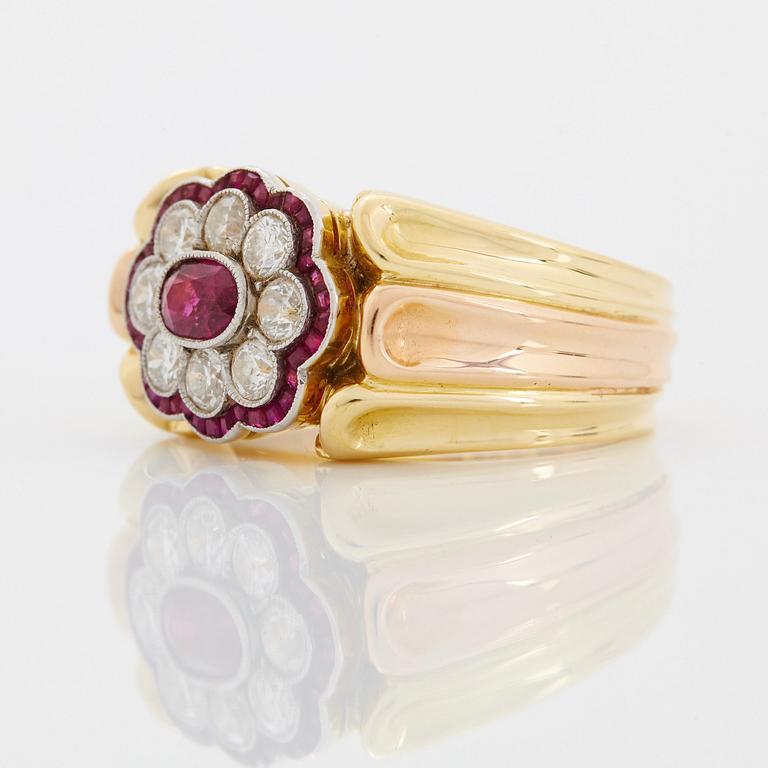 A WA Bolin ring in 18K gold set with rubies and round brilliant-cut diamonds.