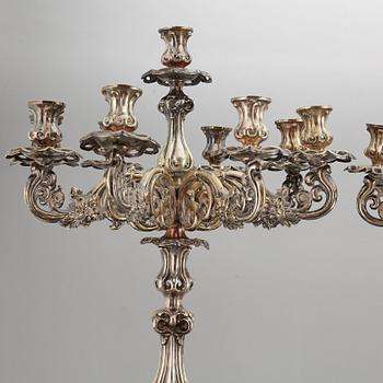 A pair of barocque style nine lights candelabra, silver plate, 20th Century.