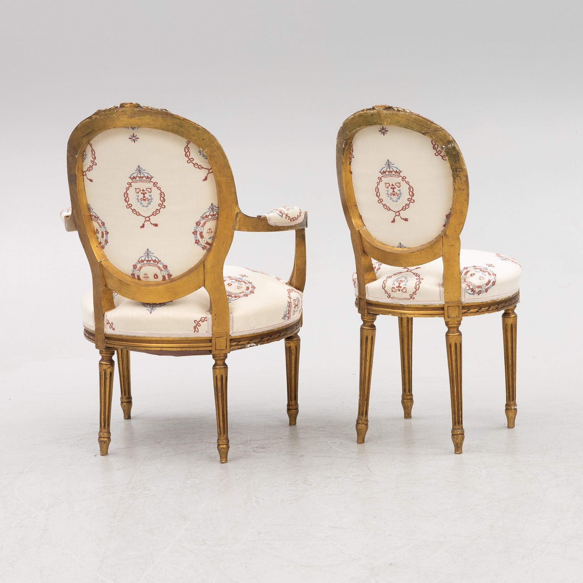 A Gustavian style sofa with two armchairs and two chairs, 20th century.