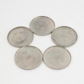 A group of 10 pewter coasters and 3 dishes, Firma Svenskt Tenn, 1948 and 1946.