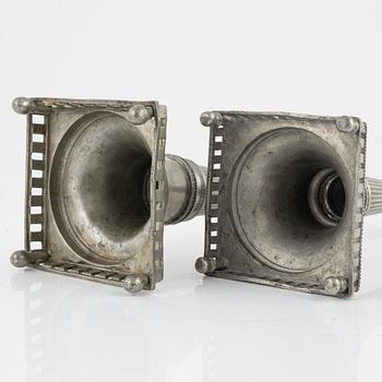 A matched pair of pewter candle sticks, 19th Century.