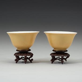 A pair of Imperial yellow bowls, Qing dynasty, Yongzheng six-character mark and of the period (1723-1735).