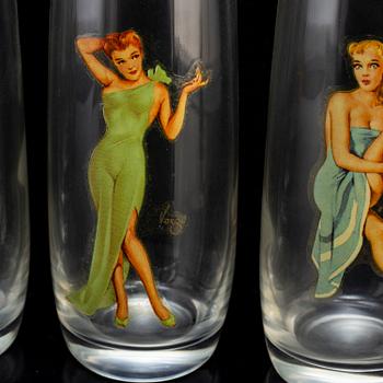 Six second half of the 20th century glasses with pictures of pinup girls.