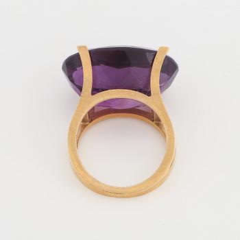 Oval faceted amethyst ring.