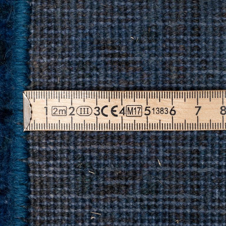 An oriental carpet, ca 408 x 299 cm.