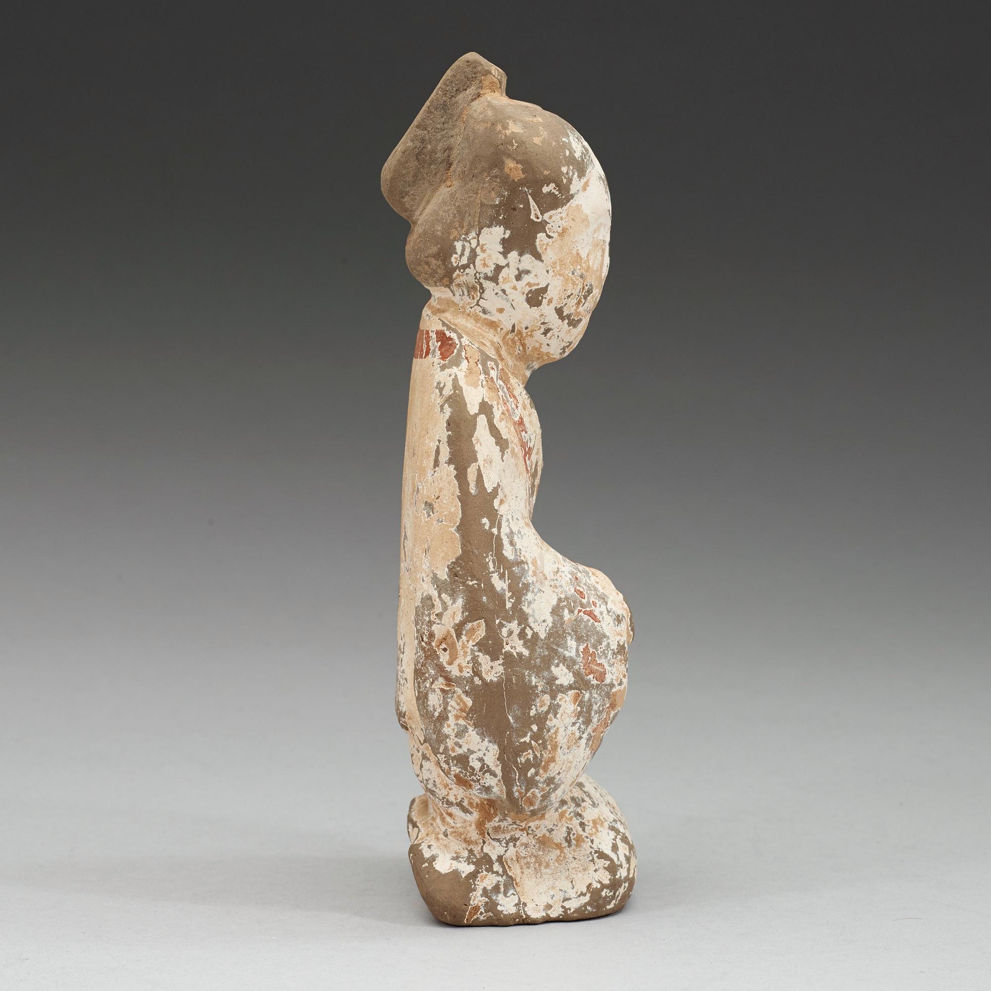 A painted pottery figure of a female attendant, Han dynasty (206 BC - AD 220).