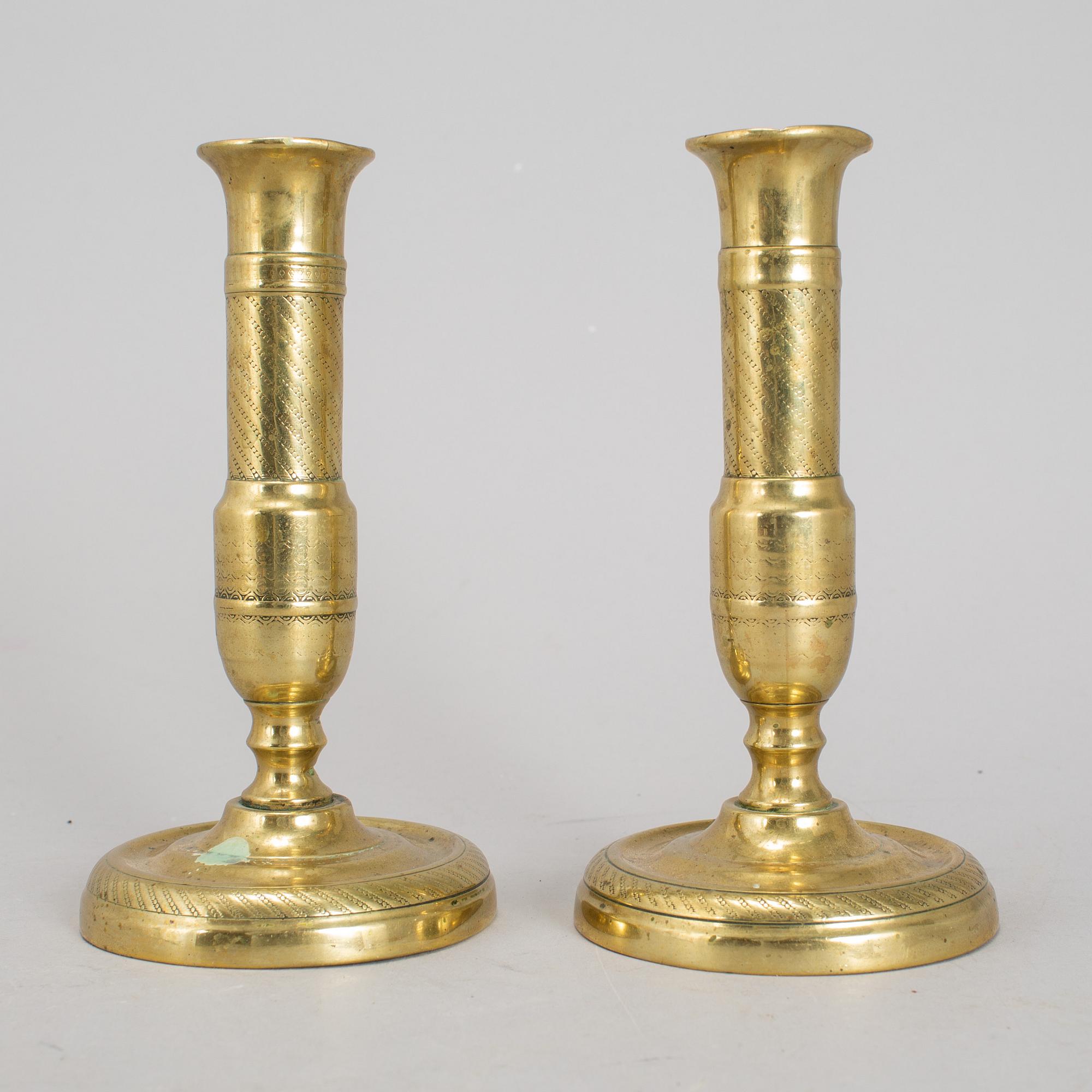 A 19th Century pair of brass candlesticks.