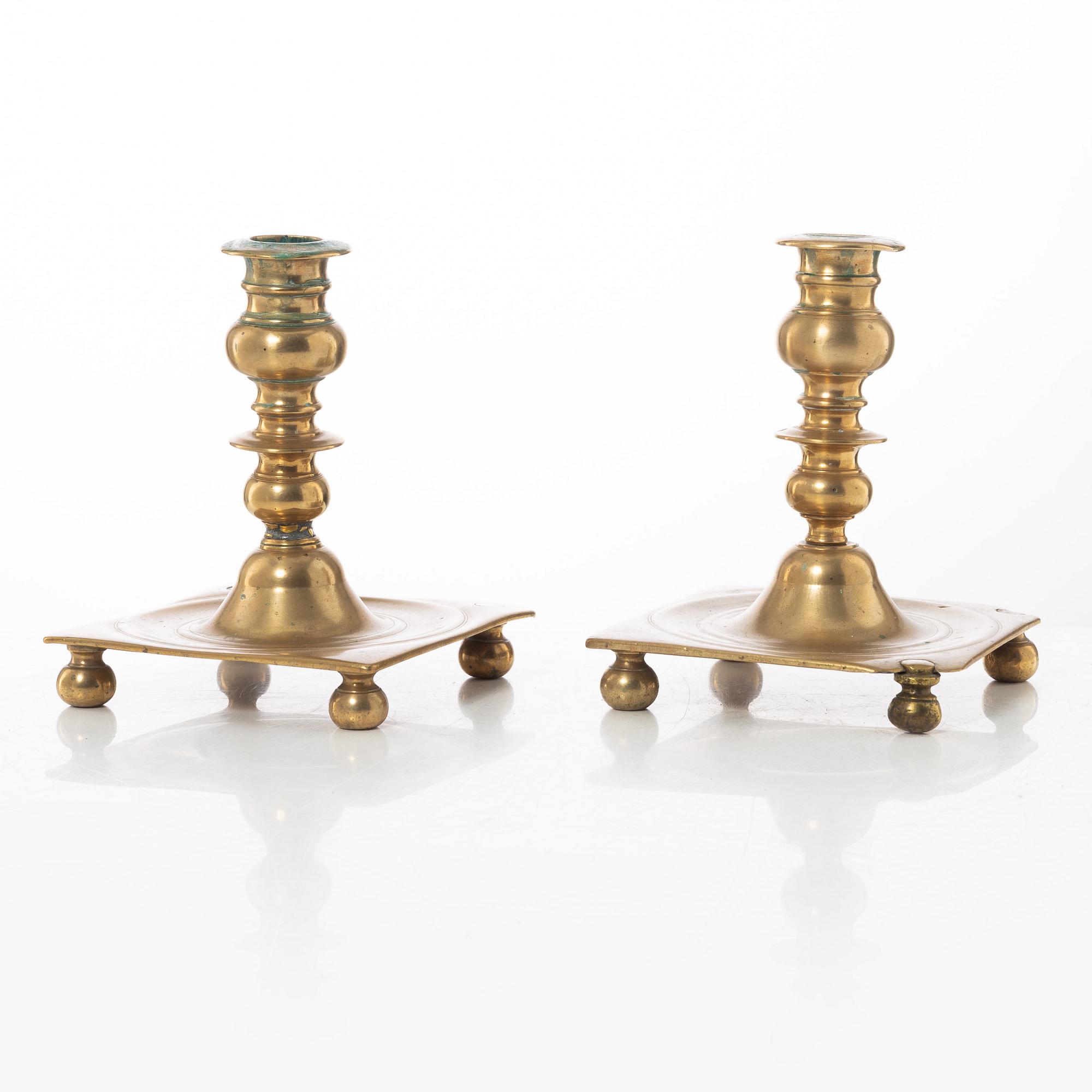 A pair of North European baroque brass candlesticks, circa 1700.