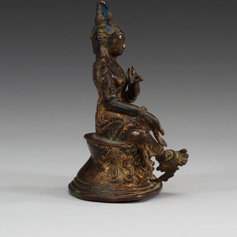 A Sinotibetan gilt bronze figure of green Tara, 18th/19th Century.