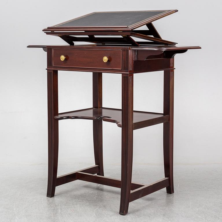 a mahogany writing desk from the second half of the 20th century.