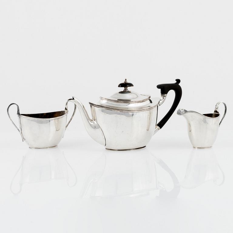 An English Silver Teapot, Creamer and Sugar Bowl, mark of Thomas Bradbury & Sons Ltd, Sheffield 1908-1910.