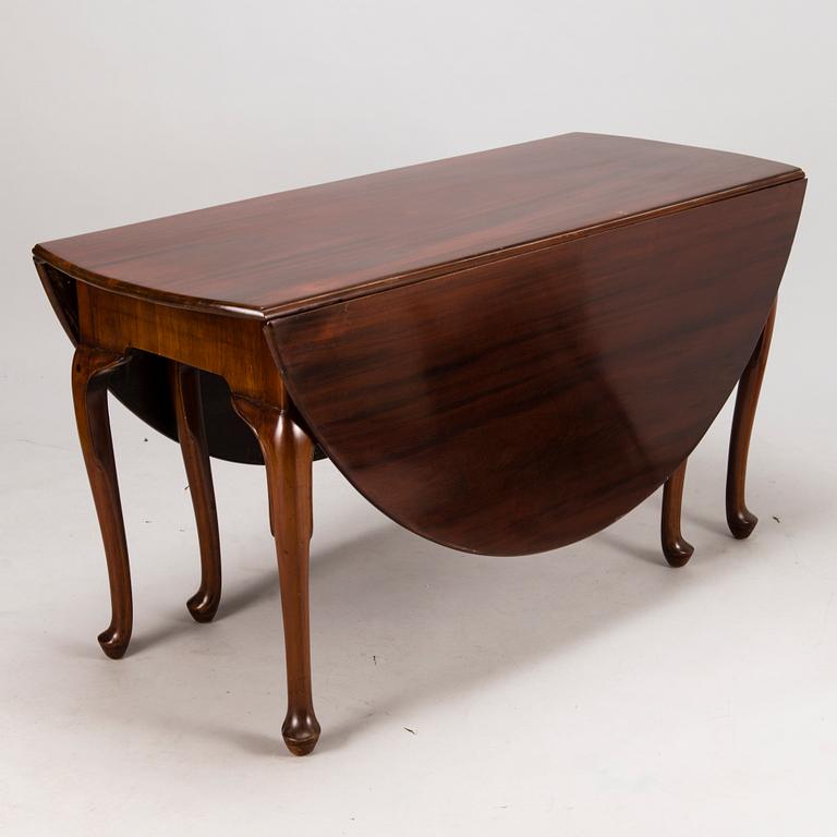 An 18th century English drop-leaf table.