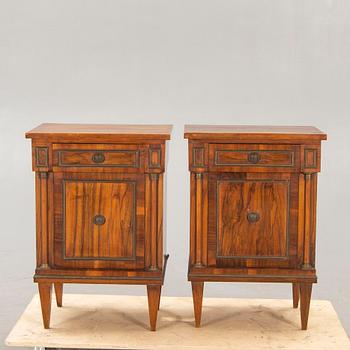 A pair of walnut Empire style bedside tables first half of the 20th century.