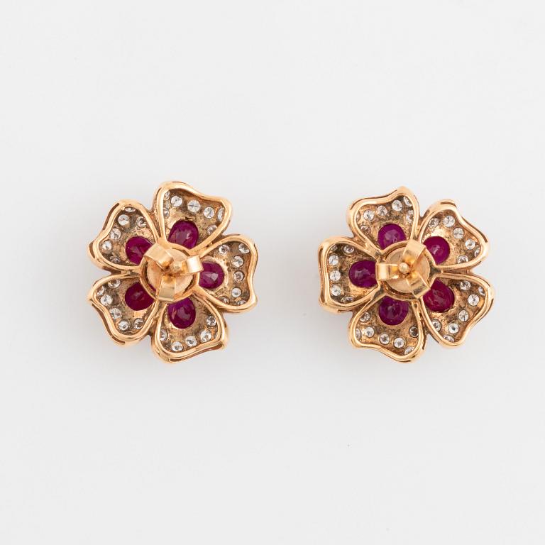 18K gold, ruby and brilliant cut diamond flower earrings.