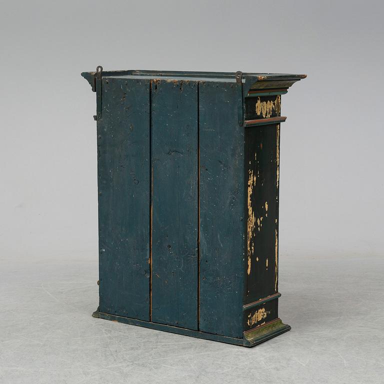 A painted wall cabinet, 19th century.