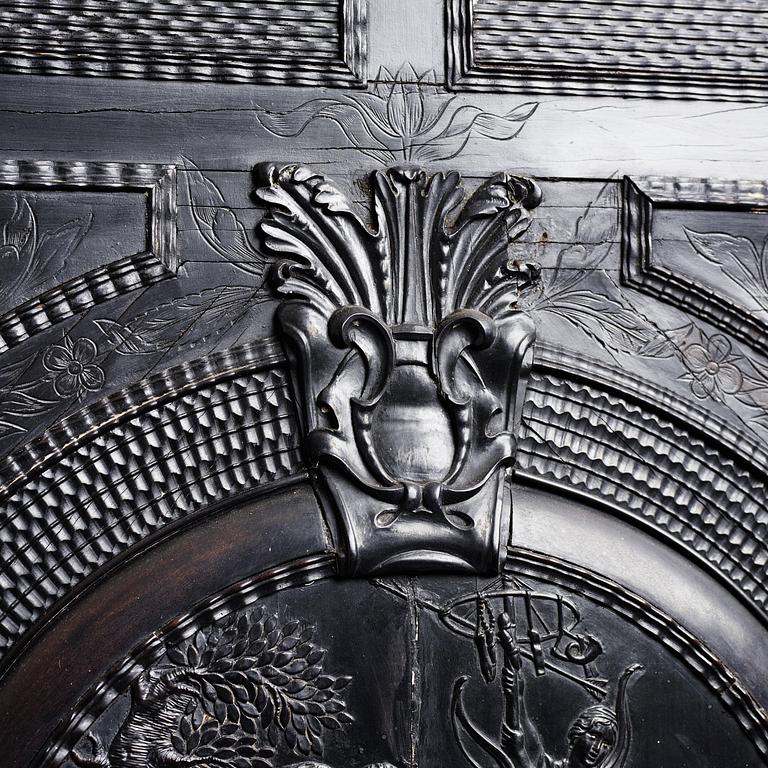 A Louis XIV and Louis XIV-style carved ebony, ivory and tortoiseshell-inlaid cabinet on stand, 17th and 19th century.