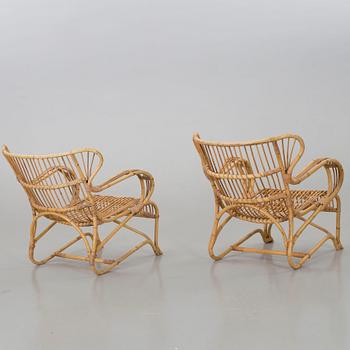 A mid 20th century ratten lounge chairs.