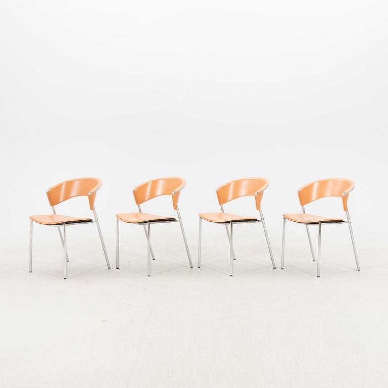 A set of four 21st century leather Italian chairs.