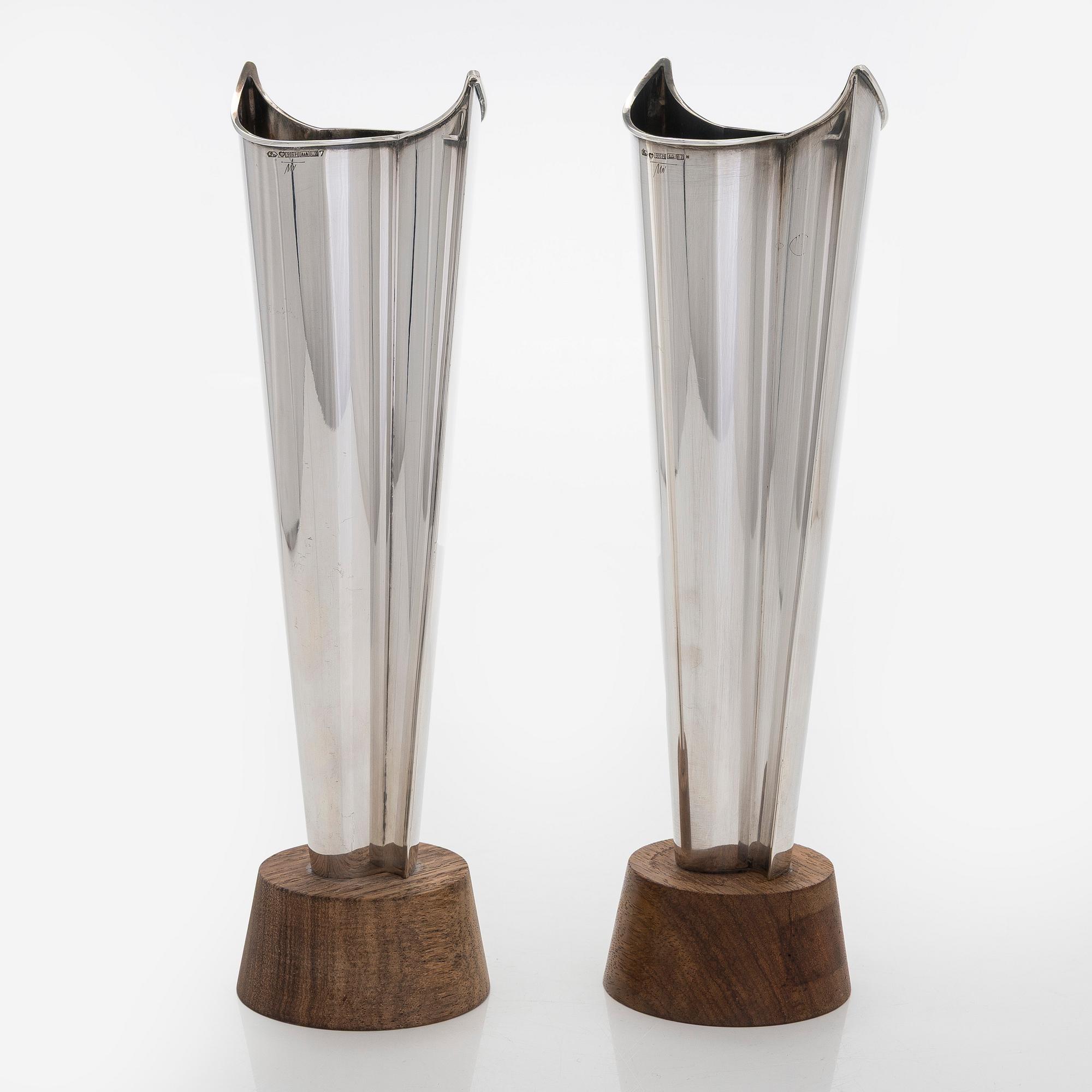 Tapio Wirkkala, two silver and teak 'Flame' vases, Kultakeskus, Hämeenlinna 1962 and 1964.