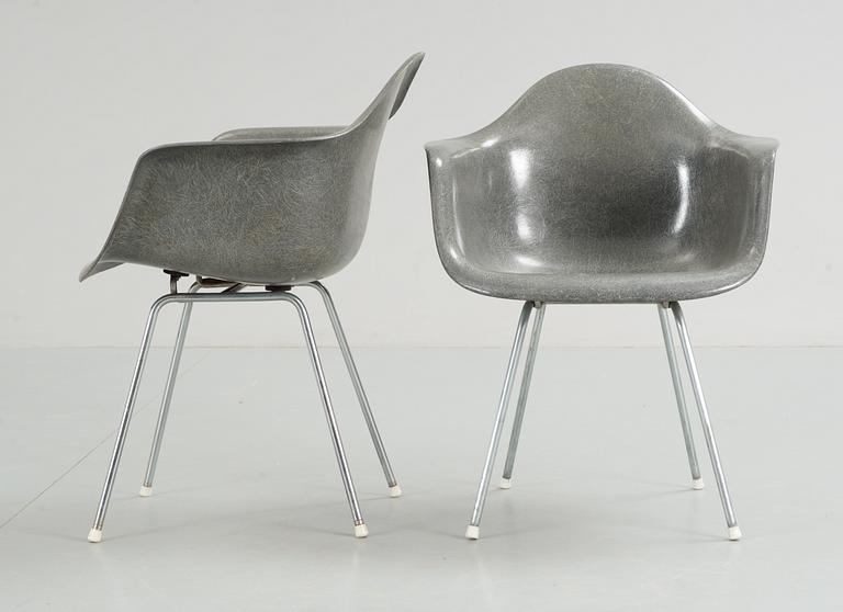 A pair of plastic chairs by Charles and Ray Eames.