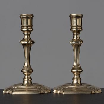 A pair of late baroque 18th century paktong candlesticks.