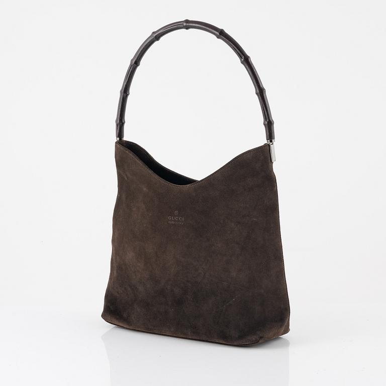 Gucci, a Bamboo suede bag.