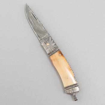 Kaj Embretsen, a damascus steel folding knife, signed.