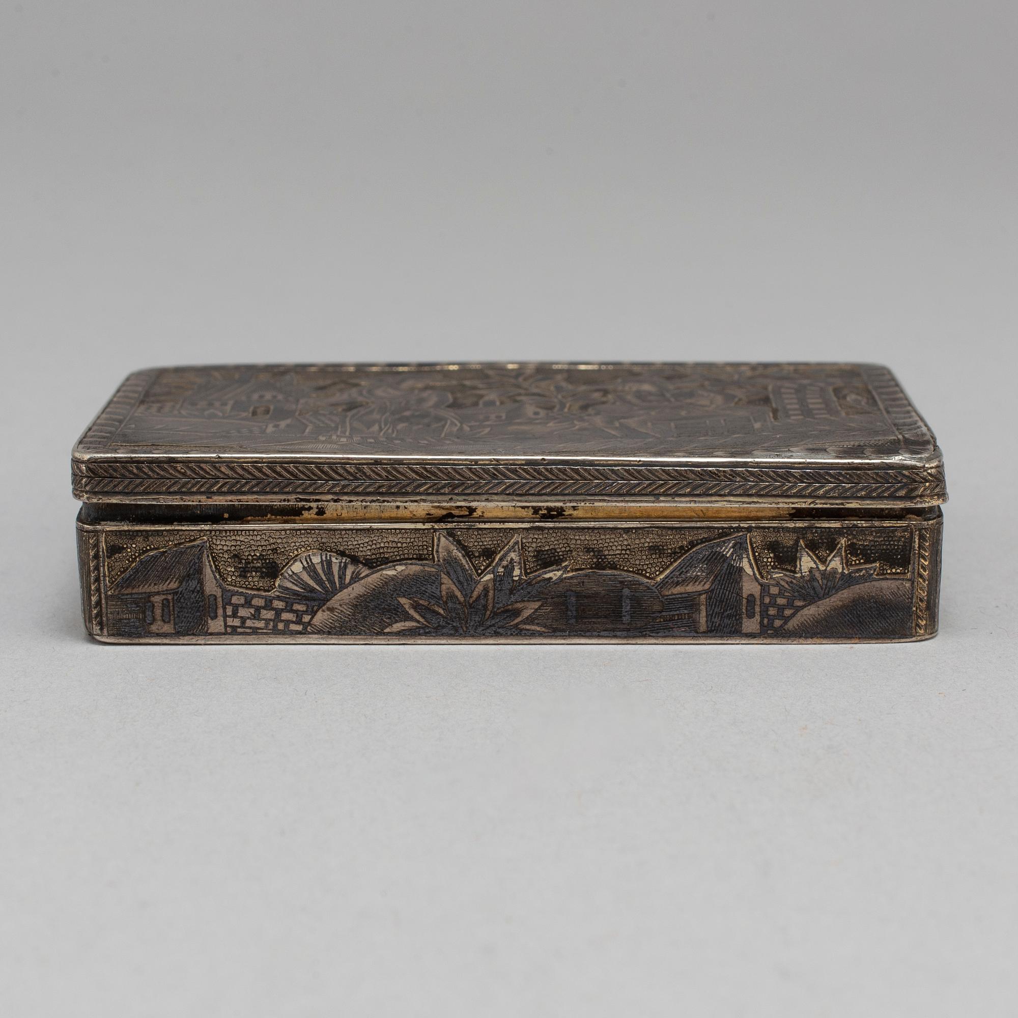 A Russian mid 19th century silver-gilt and niello snuff-box, mark of Moscow.