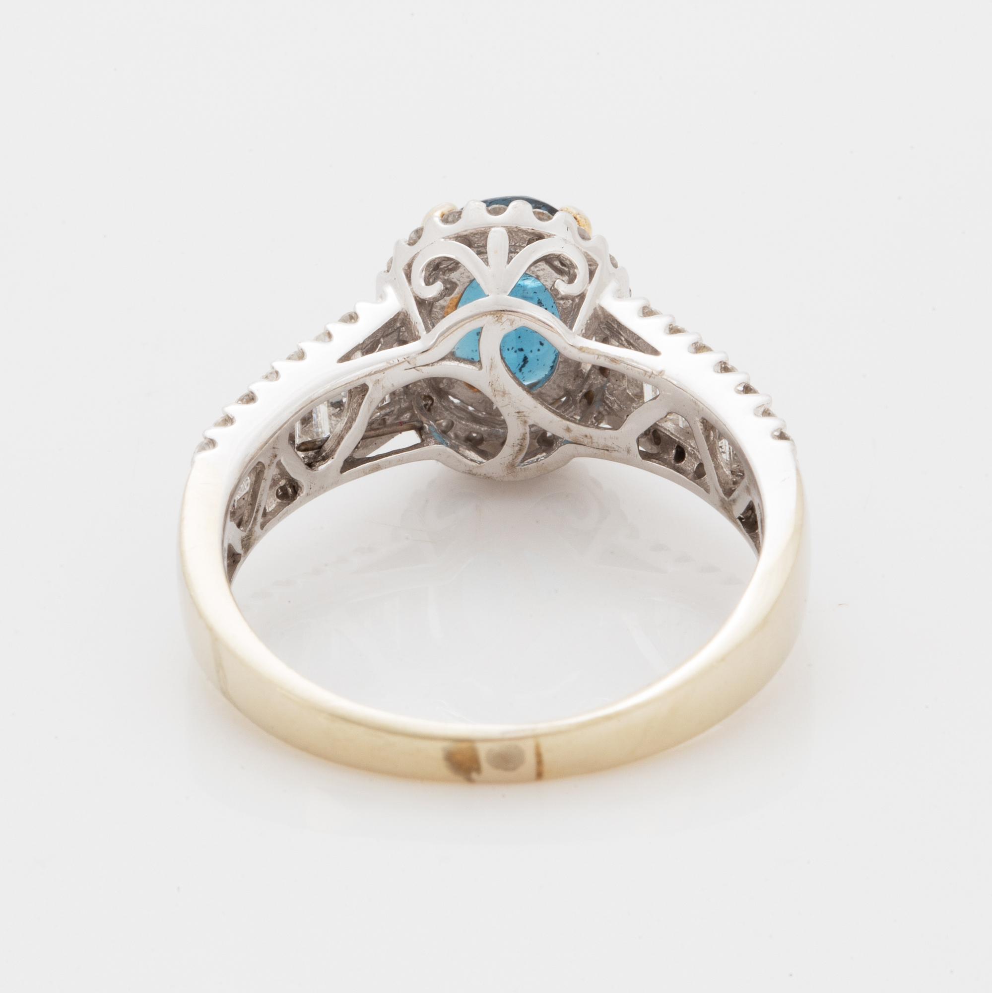 Oval faceted kyanite and diamond ring.