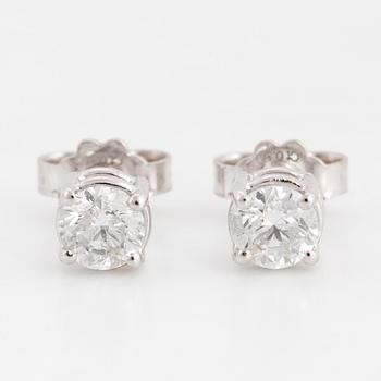 Brilliant-cut diamond stud earrings.