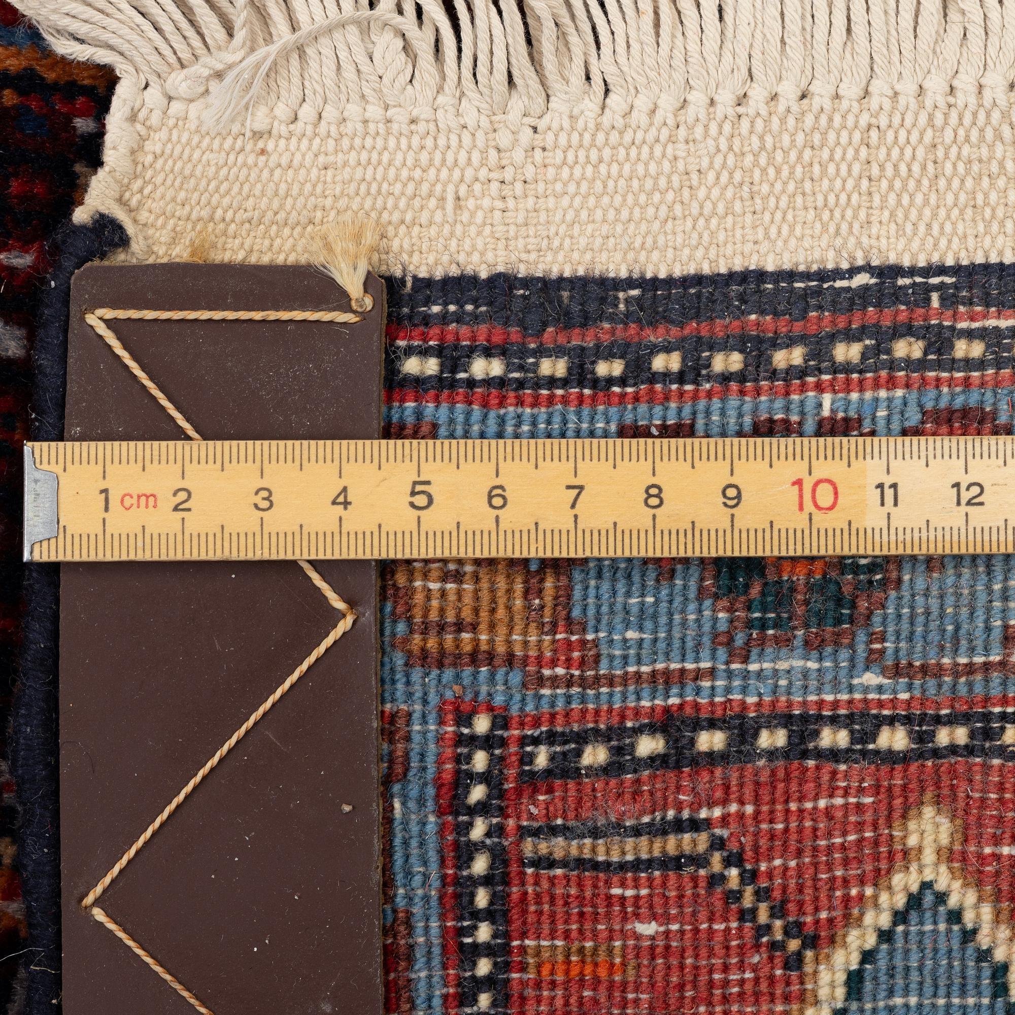 A Senneh carpet, c. 284 x 204 cm.