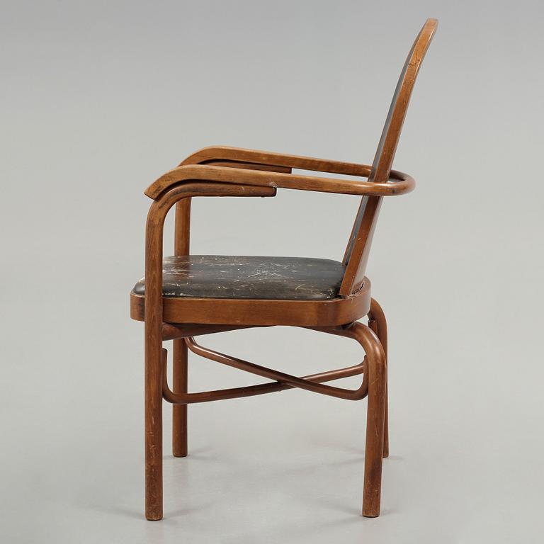 Sigurd Lewerentz, a stained beech and black leather armchair, Gemla, Sweden circa 1932.