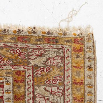 An oriental carpet, c. 195 x 70 cm.