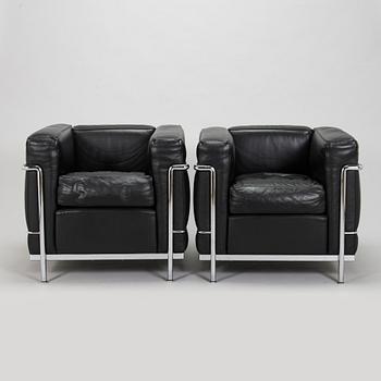 Pierre Jeanneret, Charlotte Perriand & Le Corbusier, a pair of 'LC2' armchairs, Cassina, Italy.