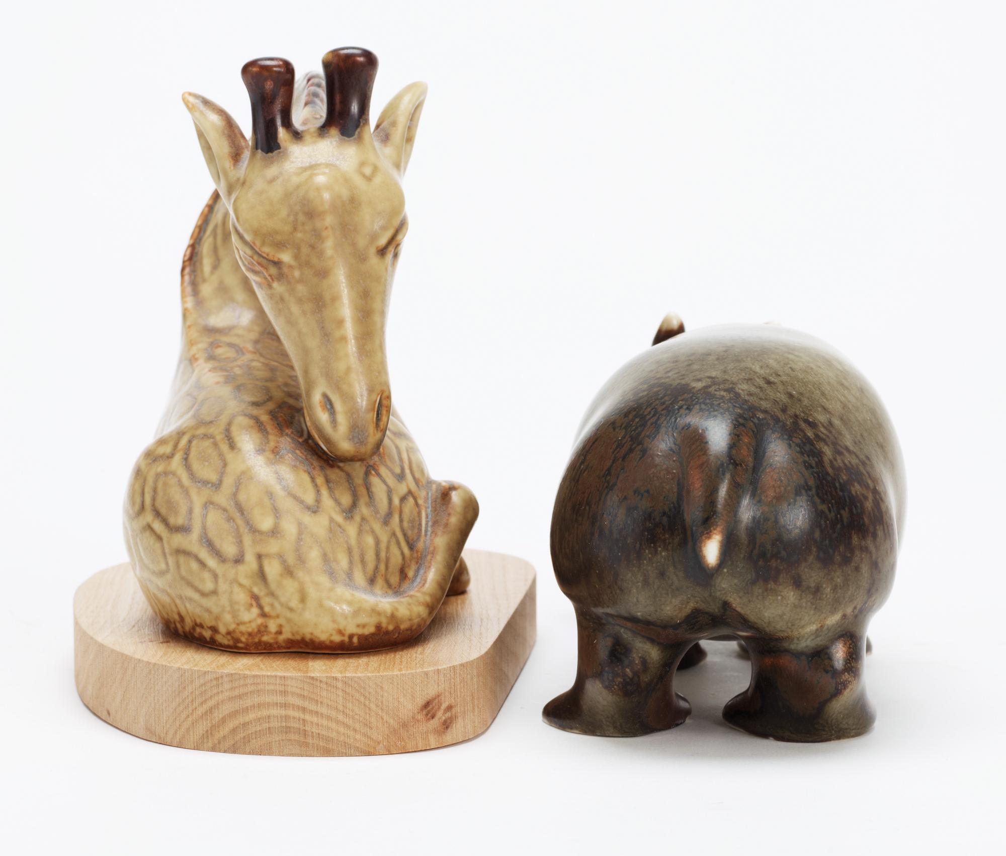 Two Gunnar Nylund stoneware figures of a hippo and a giraffe, Rörstrand.