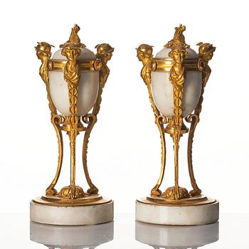 A pair of Louis XVI Cassolettes, white marble and gilt-bronze, around 1790.