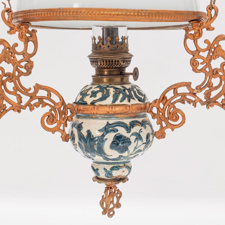 A ceiling carosene lamp, circa 1900.
