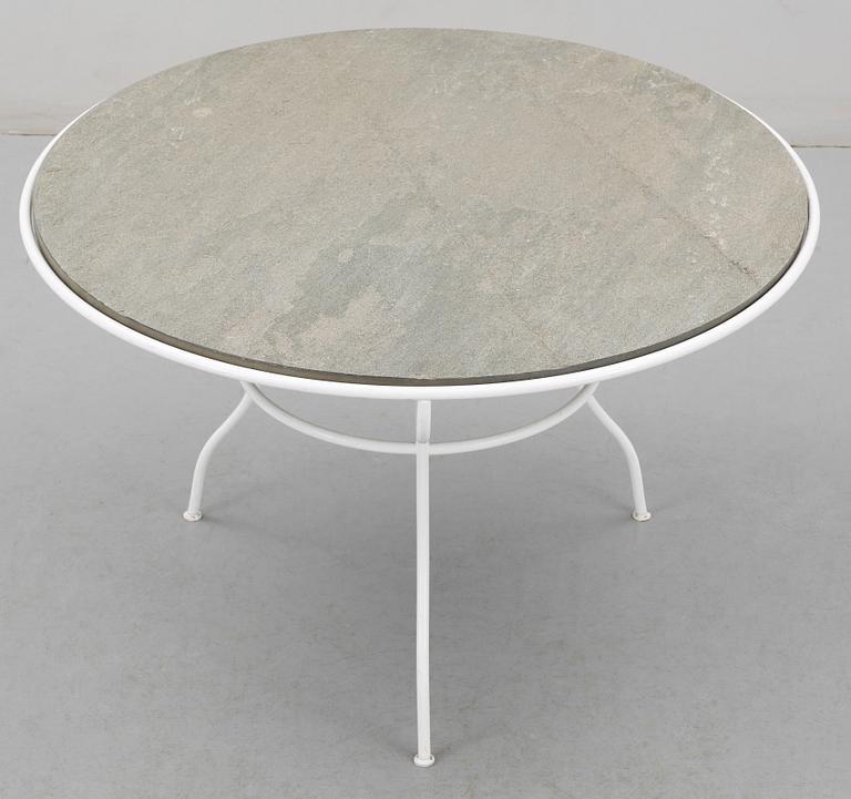 An Olle Rex lackered iron table with gray schist top by Svenskt Tenn.