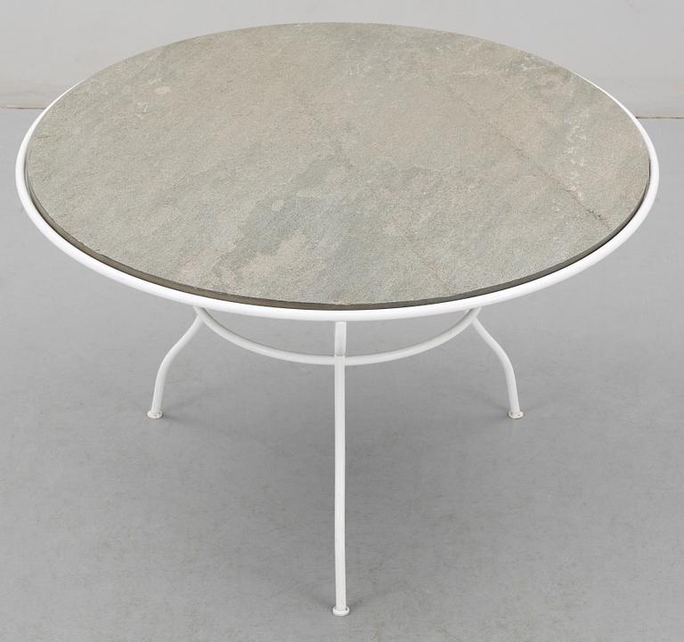 An Olle Rex lackered iron table with gray schist top by Svenskt Tenn.