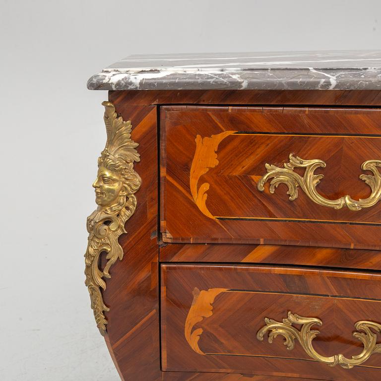 A French Louis XV marquetry and gilt-bronze mounted commode 'Aux bustes de femmes", later part of the 18th century.