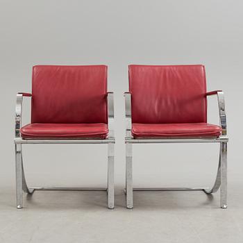 A pair of crome and leather 1970/80s armchairs.