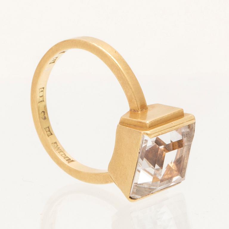 An 18K gold ring set with square step cut topaz by Wiwen Nilsson 1944.