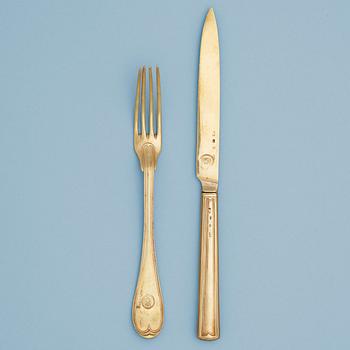 1033. A Swedish 19th century silver-gilt set of 18 piece dessert cutlery, makers mark of Adolf Zethelius, Stockholm 1812.