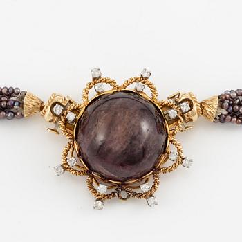 Multi-strand pearl necklace with two clasps set with carved coral, cabochon-cut tourmaline, and brilliant-cut diamonds.