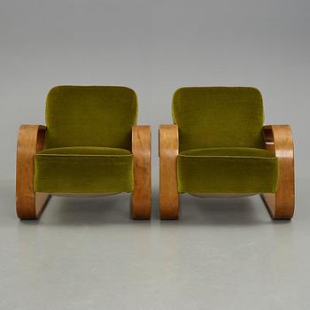 Alvar Aalto, a pair of  "Tank" easy chairs, "model 400", probably manaufactured by Aalto Design in Hedemora Sweden 1946-56.