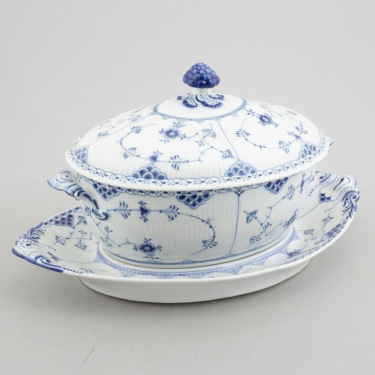 A 'Blue fluted half lace' / 'Musselmalet' porcelain tureen with cover and stand, Royal Copenhagen, model 595, 598, 1947.