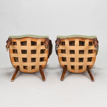 A pair of Russian armchairs and a table, late 19th century.