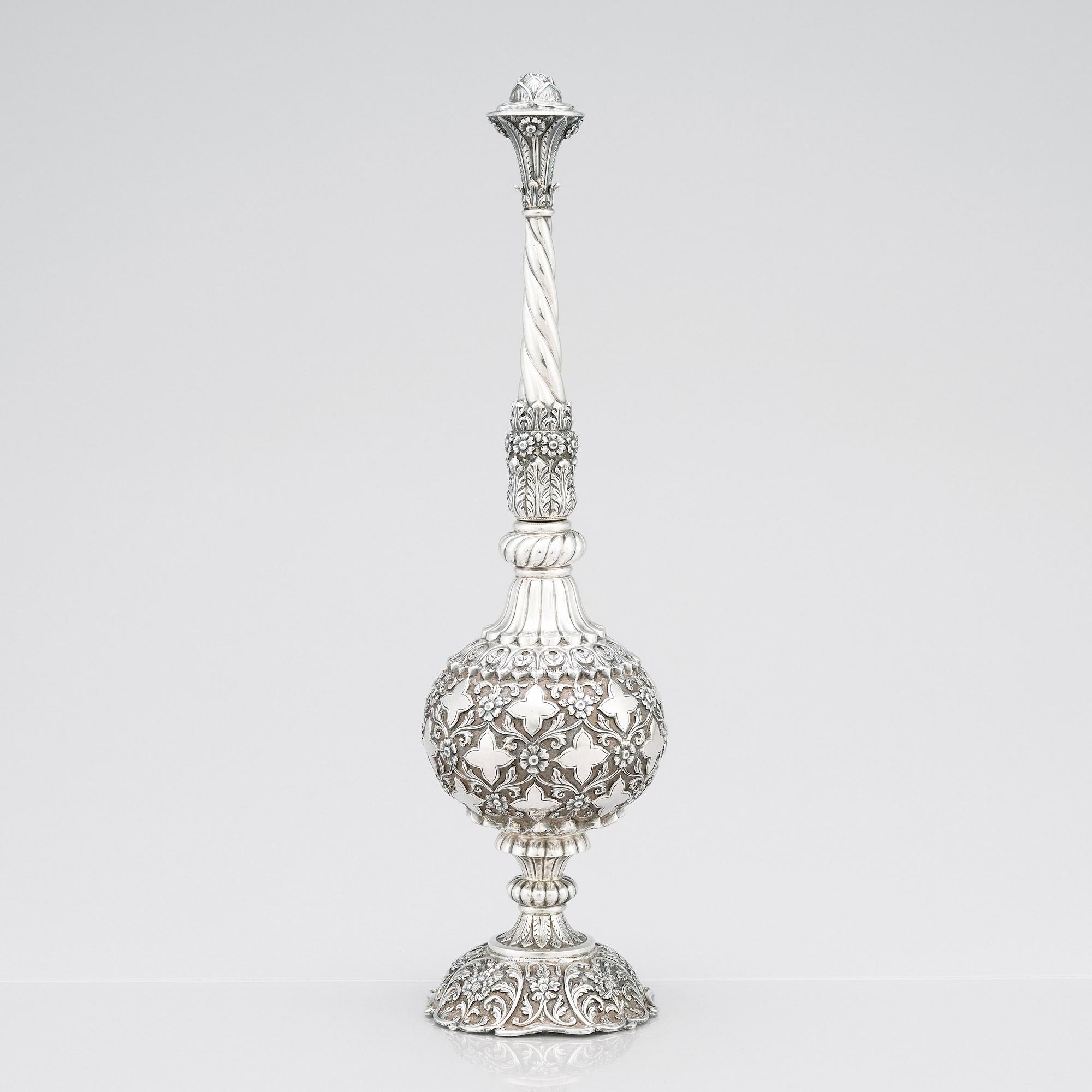 An 1880's british Raj repoussé silver rosewater sprinkler by Oomersi Mawji & Sons.