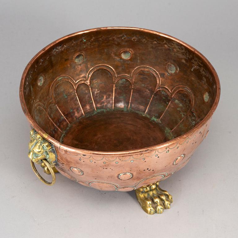 A 19th century copper and brass flower pot.